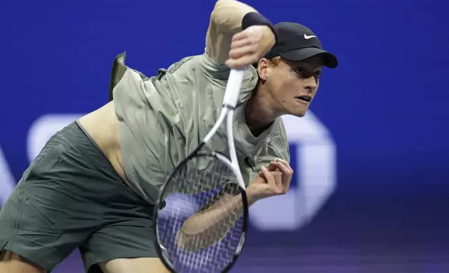 Jannik Sinner, of Italy, returns a shot to Tommy Paul, of the United States, during a fourth round match of the U.S. Open tennis championships, Monday, Sept. 2, 2024, in New York. (AP Photo/Adam Hunger)