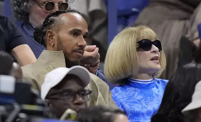 Lewis Hamilton and Anna Wintour watch the women's singles final between Aryna Sabalenka, of Belarus, and Jessica Pegula, of the United States, of the U.S. Open tennis championships, Saturday, Sept. 7, 2024, in New York. (AP Photo/Frank Franklin II)