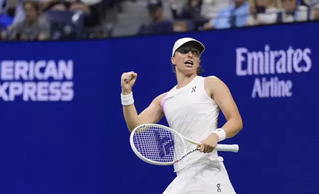 Iga Swiatek, of Poland, reacts after defeating Anastasia Pavlyuchenkova, of Russia, during the third round of the U.S. Open tennis championships, Saturday, Aug. 31, 2024, in New York. (AP Photo/Matt Rourke)