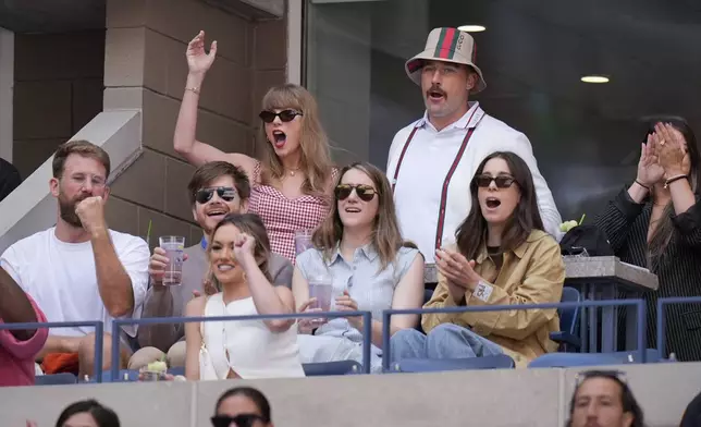 Taylor Swift and Kansas City Chiefs tight end Travis Kelce, watch play between Jannik Sinner, of Italy, and Taylor Fritz, of the United States, during the men's singles final of the U.S. Open tennis championships, Sunday, Sept. 8, 2024, in New York. (AP Photo/Seth Wenig)