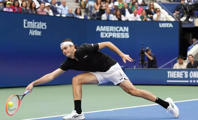 Taylor Fritz, of the United States, returns a shot to Jannik Sinner, of Italy, during the men's singles final of the U.S. Open tennis championships, Sunday, Sept. 8, 2024, in New York. (AP Photo/Kirsty Wigglesworth)