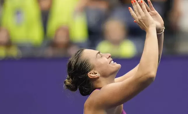 Aryna Sabalenka, of Belarus, reacts after defeating Jessica Pegula, of the United States, to win the women's singles final of the U.S. Open tennis championships, Saturday, Sept. 7, 2024, in New York. (AP Photo/Seth Wenig)