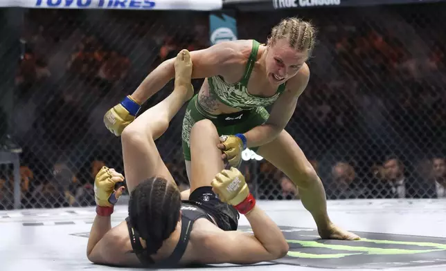 Valentina Shevchenko, right, fights Alexa Grasso in a women's flyweight mixed martial arts title bout during UFC 306 at the Sphere, Saturday, Sep. 14, 2024, in Las Vegas. (Wade Vandervort/Las Vegas Sun via AP)