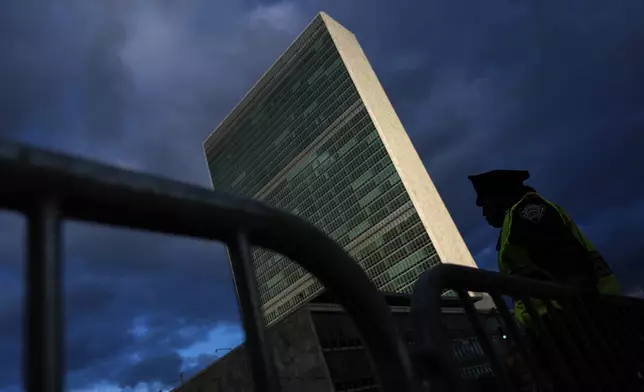 A police officer stands watch outside the UN headquarters during the 79th session of the United Nations General Assembly, Tuesday, Sept. 24, 2024, in New York. (AP Photo/Julia Demaree Nikhinson)