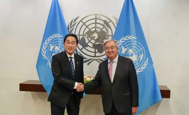 Japan's Prime Minister Fumio Kishida shakes hand with United Nations Secretary-General Antonio Guterres, right, during a meeting Sunday, Sept. 22, 2024, at U.N. headquarters. (AP Photo/Frank Franklin II)