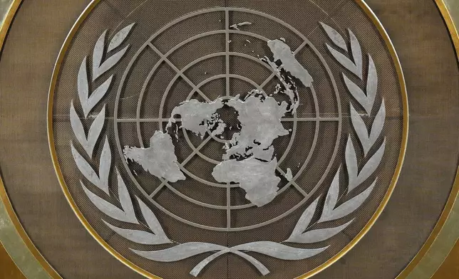 The United Nations logo is seen inside the 79th session of the United Nations General Assembly, Tuesday, Sept. 24, 2024. (AP Photo/Pamela Smith)