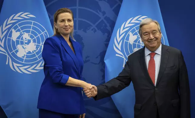 Denmark's Prime Minister, Mette Frederiksen, left, and U.N. Secretary-General, Antonio Guterres shake hands at the United Nations Headquarters, Tuesday Sept. 24, 2024. (AP Photo/Stefan Jeremiah)