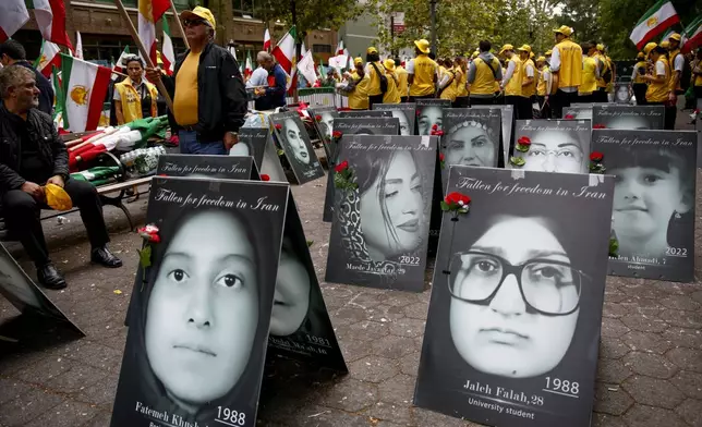 Demonstrators protest, Tuesday, Sept. 24, 2024, in New York, outside United Nations headquarters against the Iranian regime amidst portraits of women executed by the Iranian government. (AP Photo/Stefan Jeremiah)