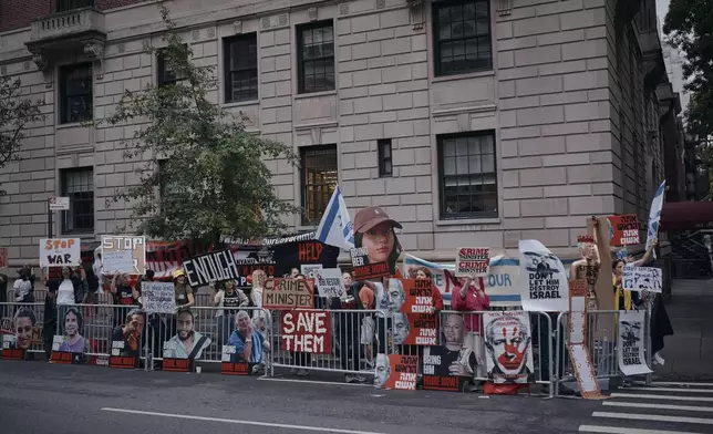 People protest against Prime Minister of Israel Benjamin Netanyahu during the 79th session of the United Nations General Assembly, in New York, on Friday, Sept. 27, 2024. (AP Photo/Andres Kudacki)