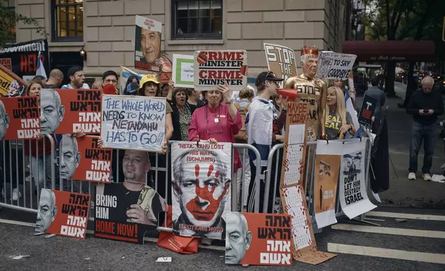 People protest against Prime Minister of Israel Benjamin Netanyahu during the 79th session of the United Nations General Assembly, in New York, on Friday, Sept. 27, 2024. (AP Photo/Andres Kudacki)