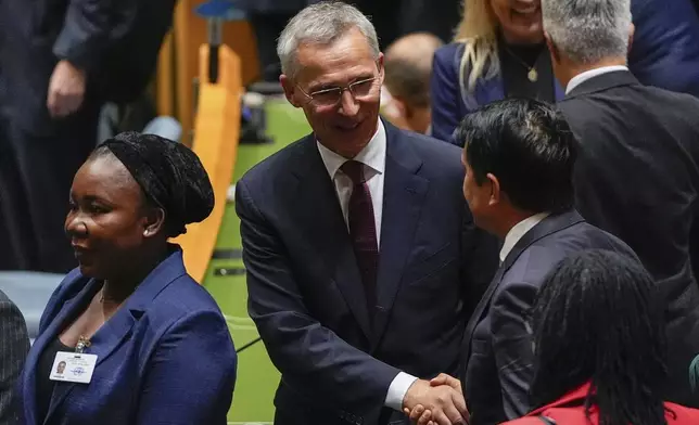 NATO Secretary General Jens Stoltenberg greets people during the 79th session of the United Nations General Assembly, Tuesday, Sept. 24, 2024, at the UN headquarters. (AP Photo/Julia Demaree Nikhinson)