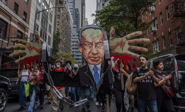 Palestinian supporters march near the United Nations headquarters at a protest against Israeli Prime Minister Benjamin Netanyahu during the 79th session of the UN General Assembly, Thursday, Sept. 26, 2024, in New York. (AP Photo/Julia Demaree Nikhinson)