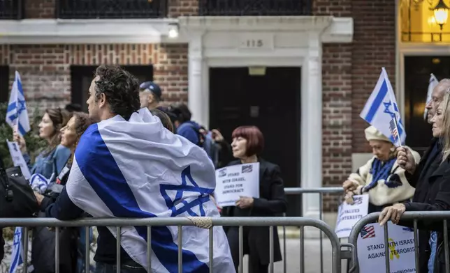 People attend a pro-Israel really held outside the Permanent Observer Mission of the State of Palestine to the United Nations building, Tuesday Sept. 24, 2024 in New York. (AP Photo/Stefan Jeremiah)