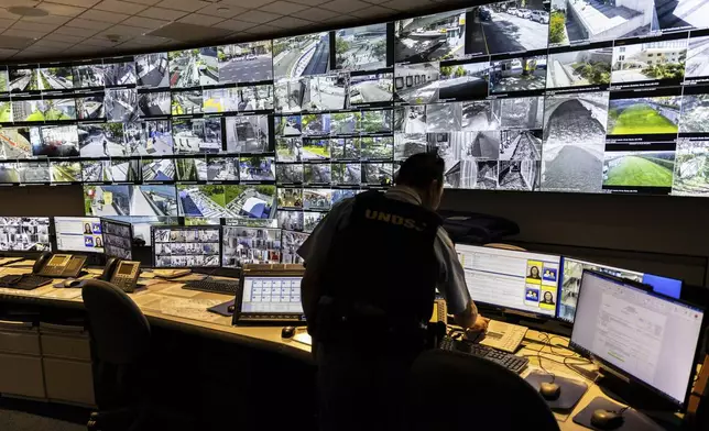 A U.N. security officer inside the U.N. Security Operations Center inside the United Nations Headquarters, Friday Sept. 20, 2024. (AP Photo/Stefan Jeremiah)