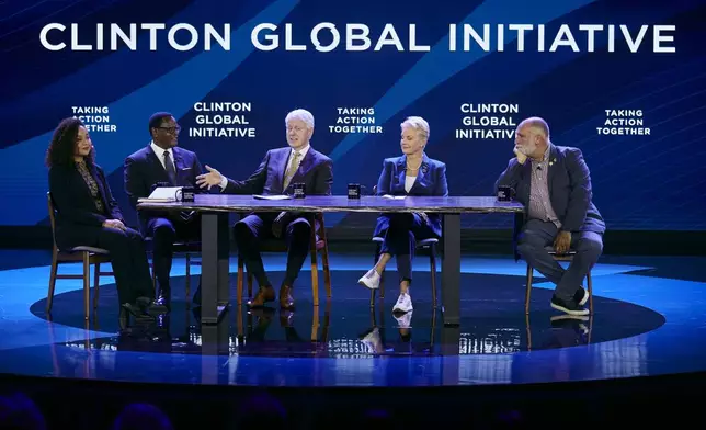 FILE -Bill Clinton, third left, speaks as Cindy McCain, Executive Director, World Food Programme, second right, Jose Andres, Founder and Chief Feeding Officer, World Central Kitchen, right, President of the Republic of Malawi, Lazarus Chakwera, second left, and Louise Emmanuelle Mabulo, Founder, The Cacao Project, left, listen during the Clinton Global Initiative, Sept. 19, 2023 in New York. (AP Photo/Andres Kudacki, File)