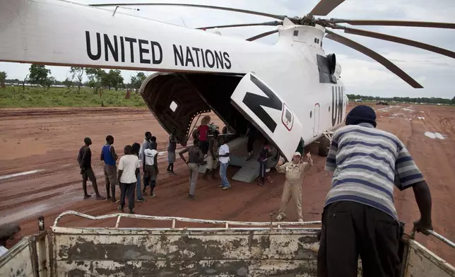 FILE -A World Food Programme (WFP) truck backs up to load food items from a recently landed UN helicopter, in Yida camp, South Sudan, Sept. 14, 2012. (AP Photo/Mackenzie Knowles-Coursin, File)