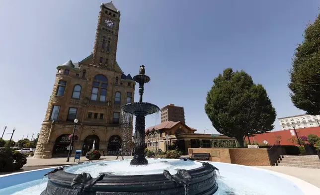 Water flows through the fountain in Fountain Square in Springfield, Ohio, Wednesday, Sept. 11, 2024. (AP Photo/Paul Vernon)