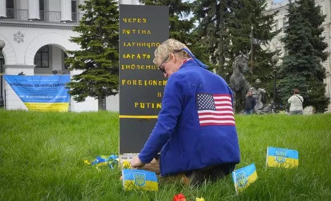 Ryan Wesley Routh pays tribute to foreign citizens killed during Russia-Ukraine war in a central square in Kyiv, Ukraine, Saturday, April 30, 2022. (AP Photo/Efrem Lukatsky)