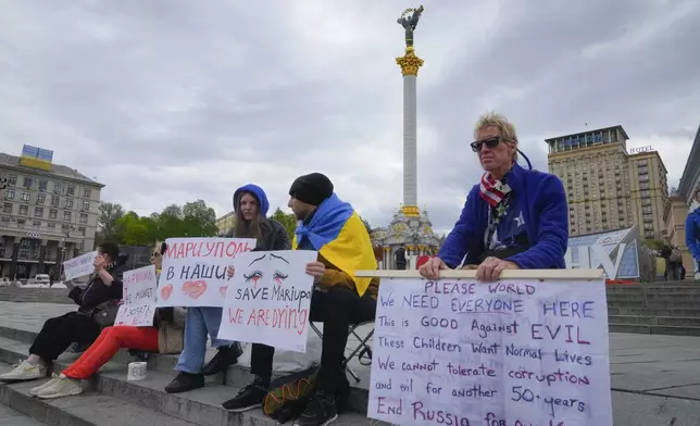 Ryan Wesley Routh, right, takes part in a rally in central Kyiv, Ukraine, Saturday, April 30, 2022. (AP Photo/Efrem Lukatsky)