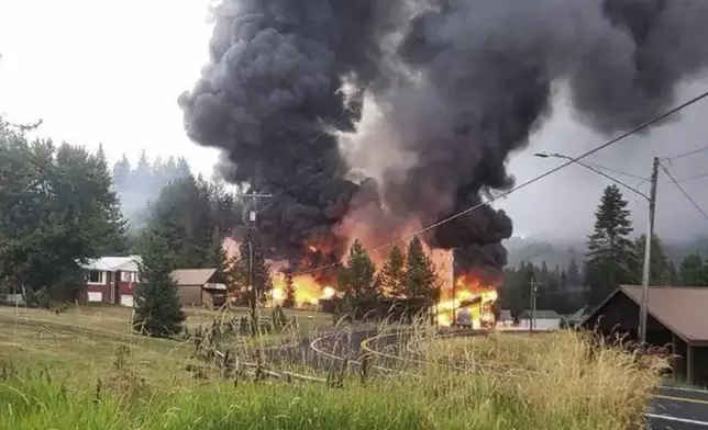 This photo provided by the Idaho Transportation Department shows the fire that occurred after a gas station exploded as a fuel tanker was filling the above-ground tanks on Sept. 11, 2024, in Cardiff, Idaho. (Idaho Transportation Department via AP)