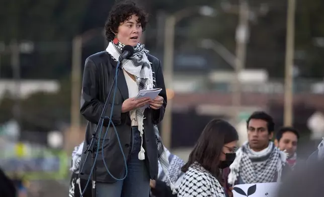 Zho Ragen, a friend of the 26-year old Aysenur Ezgi Eygi, killed recently in the occupied West Bank, during vigil on Alki Beach, Wednesday, Sept. 11, 2024, in Seattle. Eygi grew up in Seattle, attended Seattle Public Schools and graduated from the University of Washington. (AP Photo/John Froschauer)