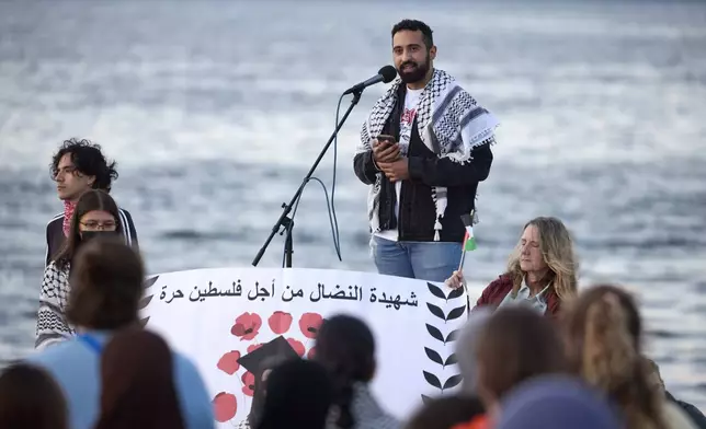 Yoseph Gazal, a friend of the 26-year old Aysenur Ezgi Eygi, killed recently in the occupied West Bank, during vigil on Alki Beach, Wednesday, Sept. 11, 2024, in Seattle. Eygi grew up in Seattle, attended Seattle Public Schools and graduated from the University of Washington. (AP Photo/John Froschauer)