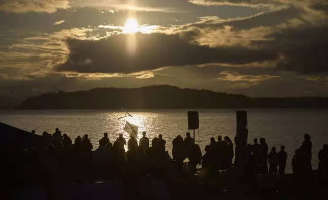 Attendees gather for a vigil on Alki Beach for the death of the 26-year old Aysenur Ezgi Eygi, killed recently in the occupied West Bank, Wednesday, Sept. 11, 2024, in Seattle. Eygi grew up in Seattle, attended Seattle Public Schools and graduated from the University of Washington. (AP Photo/John Froschauer)