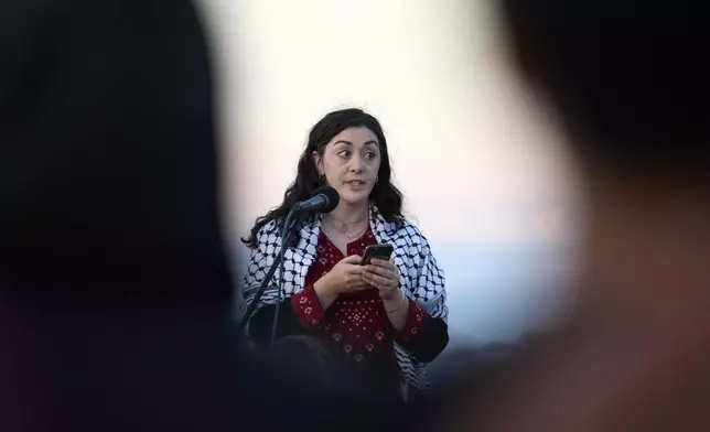 Kelsie Nabass, a friend of the 26-year old Aysenur Ezgi Eygi, killed recently in the occupied West Bank, during vigil on Alki Beach, Wednesday, Sept. 11, 2024, in Seattle. (AP Photo/John Froschauer)