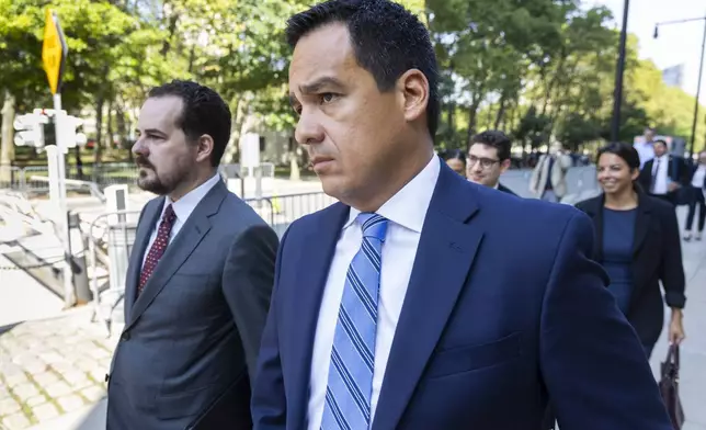 Assistant U.S. Attorney Francisco Navarro, right, leaves Brooklyn Federal court after the arraignment of longtime drug cartel leader Ismael “El Mayo” Zambada, Friday, Sept.13, 2024, in New York. (AP Photo/Corey Sipkin)