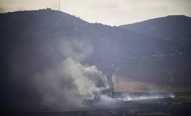 FILE - Smoke rises after an Israeli shelling on an area in Lebanon, seen from the Israel-annexed Golan Heights, next to the Israeli-Lebanese border, Sept. 16, 2024. (AP Photo/Leo Correa, FIle)