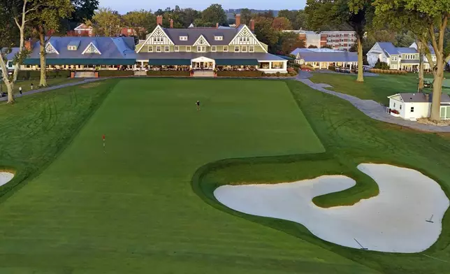 This is the ninth green in front of the clubhouse at Oakmont Country Club, in Oakmont, Pa., on Monday, Sept. 16, 2024. (AP Photo/Gene J. Puskar)