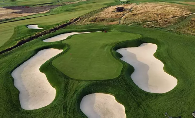 The thirteenth green gets mowed at Oakmont Country Club, in Oakmont, Pa., on Monday, Sept. 16, 2024. (AP Photo/Gene J. Puskar)