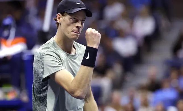 Jannik Sinner, of Italy, pumps his fist after winning a point against Daniil Medvedev, of Russia, during the quarterfinals of the U.S. Open tennis championships, Wednesday, Sept. 4, 2024, in New York. (AP Photo/Adam Hunger)