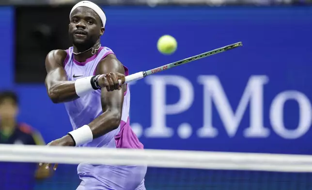 Frances Tiafoe, of the United States, returns against Grigor Dimitrov, of Bulgaria, during the quarterfinals of the U.S. Open tennis championships, Tuesday, Sept. 3, 2024, in New York. (AP Photo/Adam Hunger)