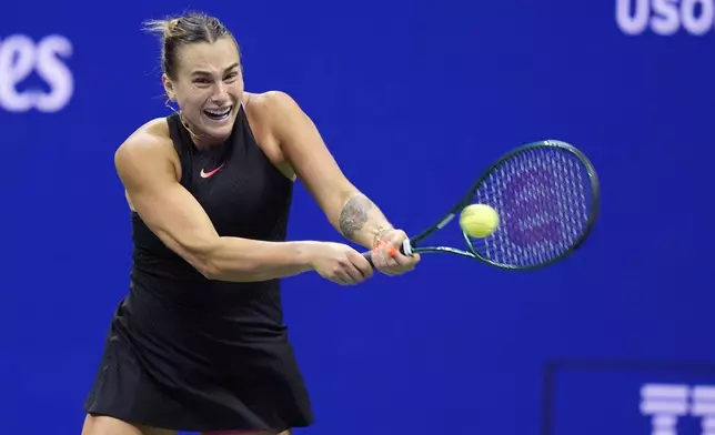 Aryna Sabalenka, of Belarus, returns to Zheng Qinwen, of China, during the quarterfinals of the U.S. Open tennis championships, Tuesday, Sept. 3, 2024, in New York. (AP Photo/Eduardo Munoz Alvarez)