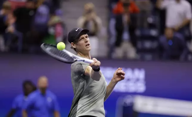 Jannik Sinner, of Italy, launches a ball after defeating Daniil Medvedev, of Russia, during the quarterfinals of the U.S. Open tennis championships, Wednesday, Sept. 4, 2024, in New York. (AP Photo/Adam Hunger)