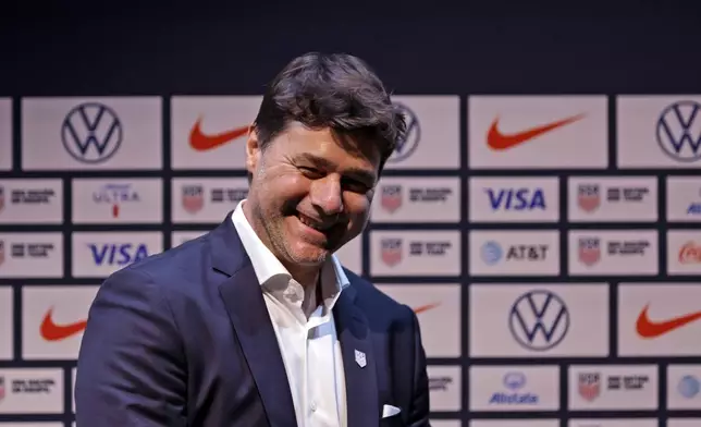 Mauricio Pochettino, the newly appointed head coach of the United States men's national soccer team, smiles after a press conference Friday, Sept. 13, 2024, in New York. (AP Photo/Adam Hunger)