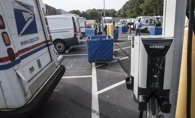 Mail delivery vehicles are seen at a post office on Thursday, Sept. 5, 2024, in Athens Ga. (AP Photo/Ron Harris)