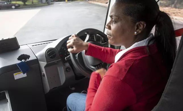 U.S. Postal Service delivery driver Avis Stonum maneuvers one the the newest fleet vehicles through the work lot of a postal facility on Thursday, Sept. 5, 2024, in Athens, Ga. (AP Photo/Ron Harris)