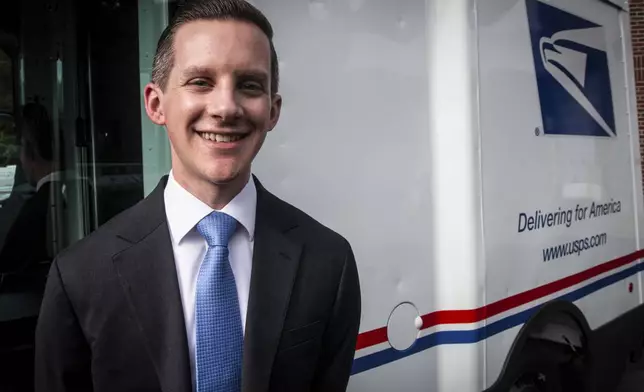 Patrick Ecker, executive manager of fleet services for the U.S. Postal Service, stands in front of a new mail delivery truck on Thursday, Sept. 5, 2024, in Athens, Ga. (AP Photo/Ron Harris)