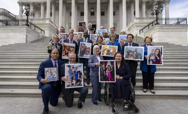 Front row, left to right, Sen. Cory Booker, D-NJ., Senate Majority Leader Chuck Schumer, D-NY, Sen. Patty Murray, D-Wash., and Sen. Tammy Duckworth, D-Ill., pose for a photograph after speaking about the need to protect rights to in vitro fertilization (IVF), on the Senate steps at the Capitol in Washington, Tuesday, Sept. 17, 2024. (AP Photo/Ben Curtis)