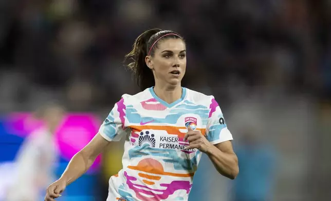 San Diego Wave forward Alex Morgan (13) runs during an NWSL soccer match against Seattle Reign, Friday, March 29, 2024, in San Diego. (AP Photo/Kyusung Gong)