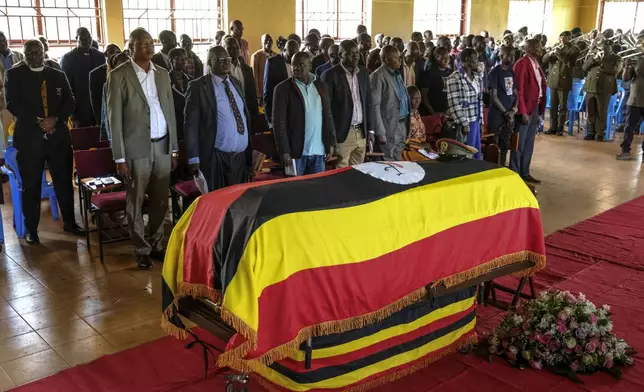 Members of the public gather for a funeral service of Ugandan Olympic athlete Rebecca Cheptegei ahead of her burial in Kapkoros, Bukwo District, Uganda Saturday, Sept. 14. 2024. (AP Photo/Hajarah Nalwadda)