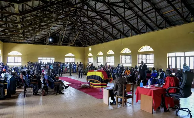 Members of the public gather for a funeral service of Ugandan Olympic athlete Rebecca Cheptegei ahead of her burial in Kapkoros, Bukwo District, Uganda Saturday, Sept. 14. 2024. (AP Photo/Hajarah Nalwadda)