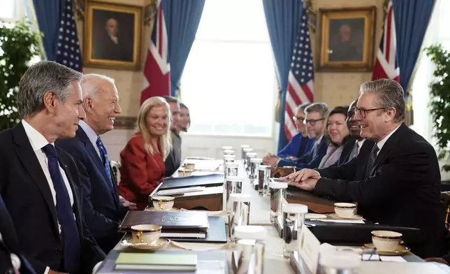 Britain's Prime Minister Keir Starmer, right, and Foreign Secretary David Lammy, second right, during a meeting with US President Joe Biden, 2nd left, in the Blue Room at the White House in Washington, Friday Sept. 13, 2024. (Stefan Rousseau/Pool via AP)