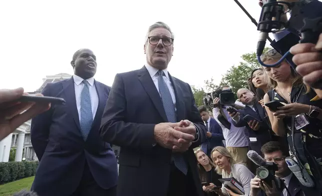 Britain's Prime Minister Keir Starmer and Foreign Secretary David Lammy, speak to the media outside the White House in Washington following a meeting with President Joe Biden, Friday, Sept. 13, 2024. (Stefan Rousseau/Pool Photo via AP)