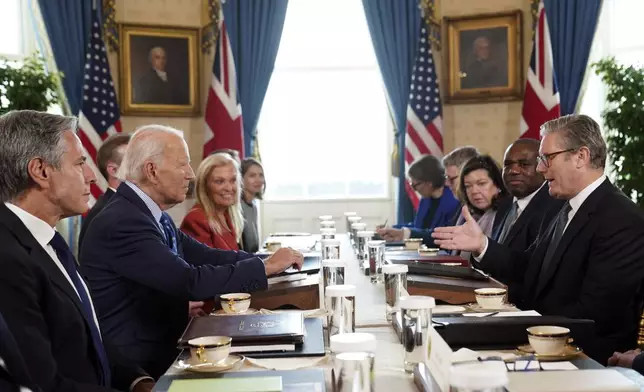 Britain's Prime Minister Keir Starmer, right, and Foreign Secretary David Lammy, second right, during a meeting with US President Joe Biden, centre left, in the Blue Room at the White House in Washington, Friday Sept. 13, 2024. (Stefan Rousseau/Pool via AP)