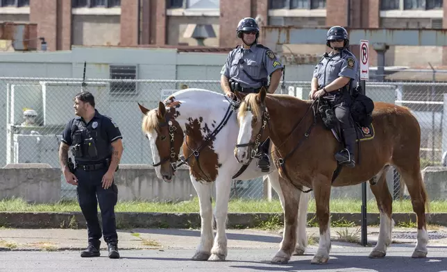 Pennsylvania State Police provide security with horses before President of Ukraine Volodymyr Zelenskyy's motorcade arrives at the Scranton Army Ammunition Plant in Scranton on Sunday, Sept. 22, 2024. (AP Photo/Laurence Kesterson)