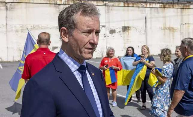 U.S. Rep. Matt Cartwright, PA-08, talks to Ukraine supporters before President of Ukraine Volodymyr Zelenskyy's motorcade arrives at the Scranton Army Ammunition Plant in Scranton on Sunday, Sept. 22, 2024. The plant manufactures artillery ammunition which is used in Ukraine. (AP Photo/Laurence Kesterson)