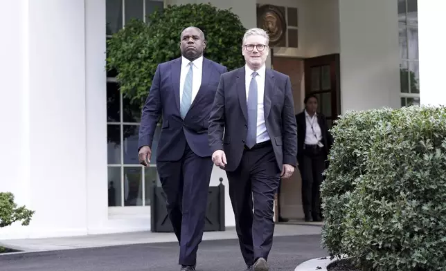 British Prime Minister Keir Starmer, right, and Foreign Secretary David Lammy leave the White House following a meeting with President Joe Biden, Friday, Sept. 13, 2024, in Washington. (Stefan Rousseau/Pool Photo via AP)